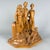 An important and rare large-scale sculpture made of carved solid wood. This figurative group, signed at the base, is...