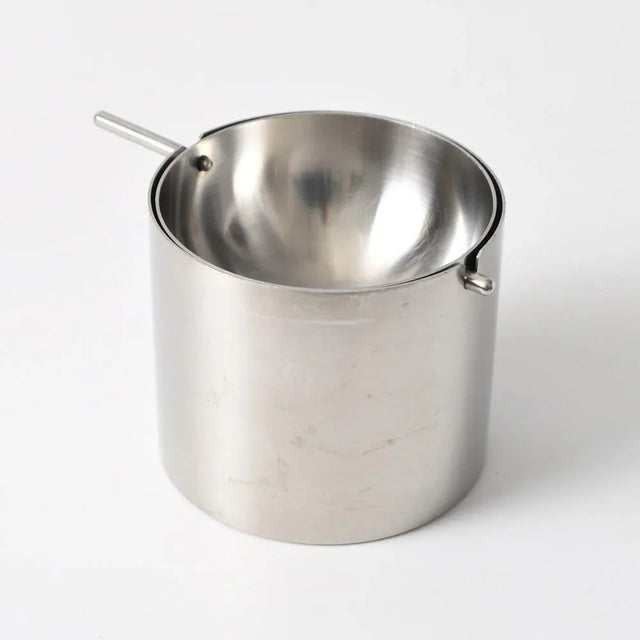 Stainless steel ashtray from the Cylinda-Line series. Designed by Arne Jacobsen for Stelton. This piece has an attribution...
