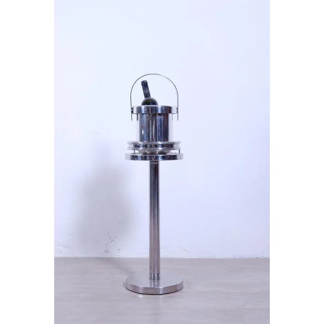 Elegant column holder table bucket. Made of stainless steel, well solid and heavy. 80s production, used very little, even...
