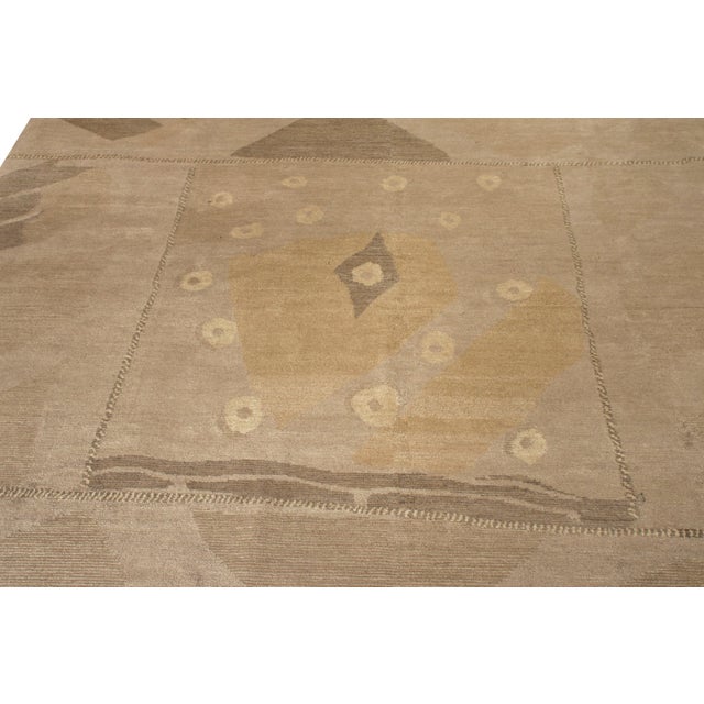 Hand knotted in a yarn mixing blending wool and silk this collectible by Rug & Kilim draws inspiration from the deco...