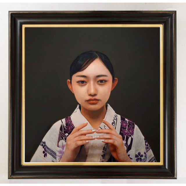 Archaic Prayer presents a serene portrait of a young woman, her expression contemplative as she holds her hands delicately...