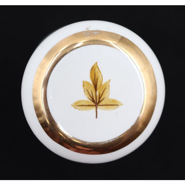 Vintage French Country style matching white ceramic single gang light switch plate and dummy door knob set. It features a...