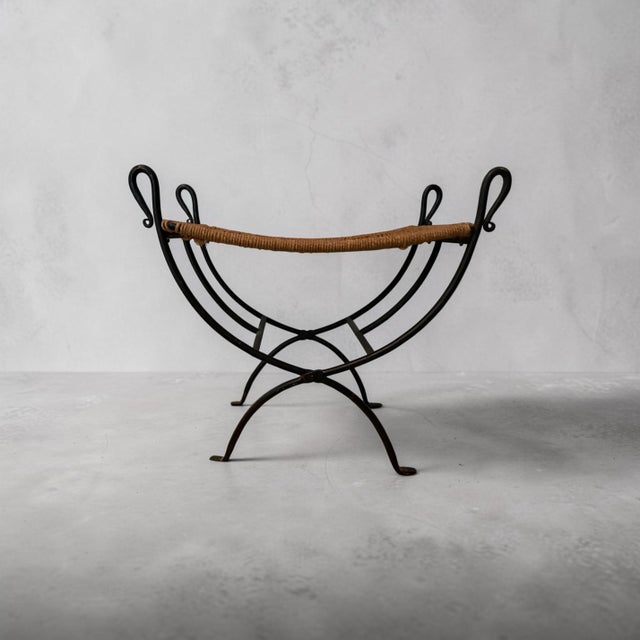 Beautiful mid-century French iron stool with woven seat. Perfect for an entry or as a seating element in a living room.