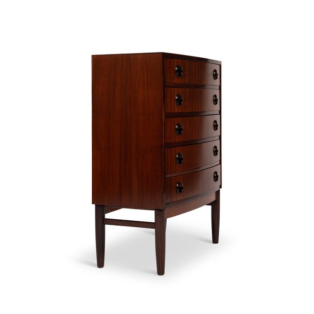 Kai Kristiansen is a renowned Danish furniture designer celebrated for his contribution to the mid-century modern...