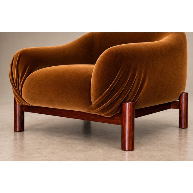 A sculptural pair of Brazilian Mid-Century Modern armchairs by Cimo, crafted in rosewood during the 1960s. Their generous...