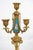 A pair of antique candlesticks in finely chiselled gilded bronze with inlays of Sèvres porcelain, dating from the second...