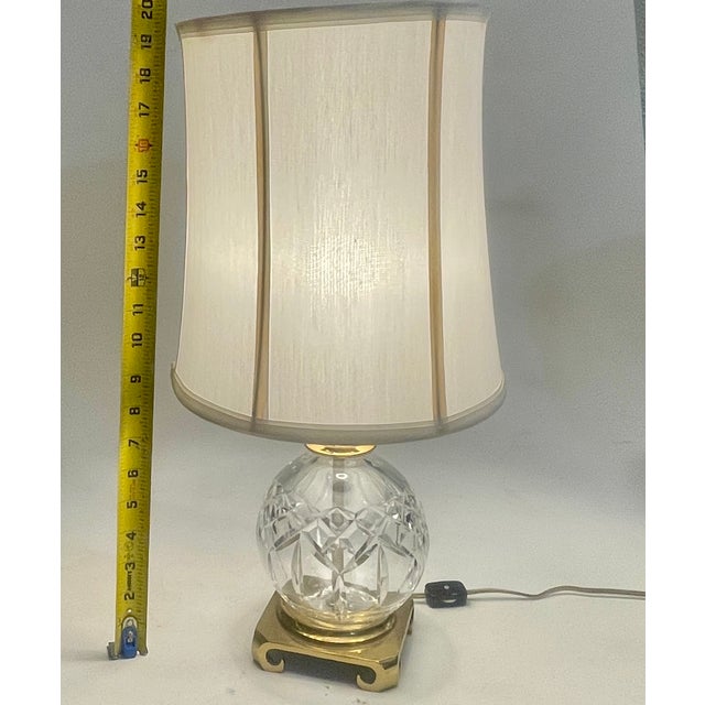This exceptional vintage mid-century table lamp features a heavy, brilliant-cut lead crystal spherical orb in Waterford’s...