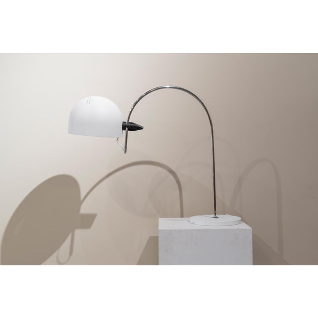 Arc-shaped table lamp made of steel and metal, height-adjustable with a black plastic insert. Shade and base diameter: 24...