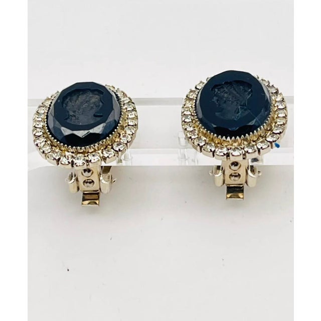 This stunning pair of 1950s Signed Hobé Cameo Intaglio Onyx and Rhinestone Earrings will take your breath away! They are...