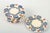 Set of six small plates, glazed ceramics hand-decorated with polychrome blue leaf garlands and red fruit motifs on a light...