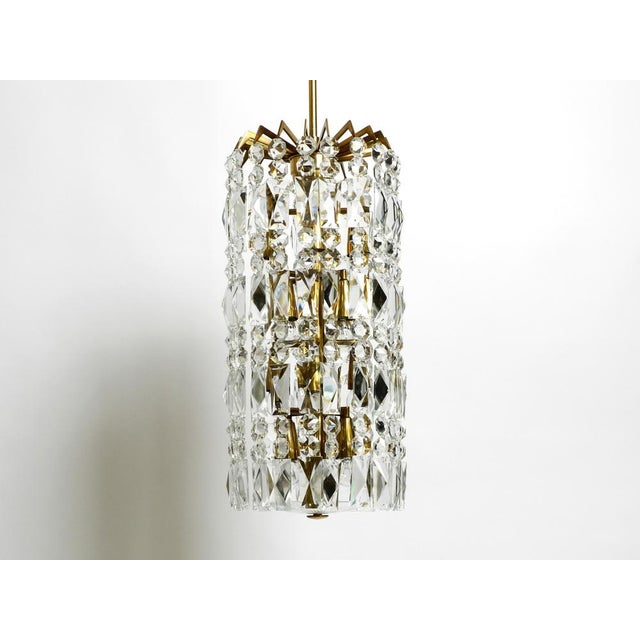 Very impressive beautiful rare mid century modern brass crystal glass chandelier. Manufactured in the 1960s by the...