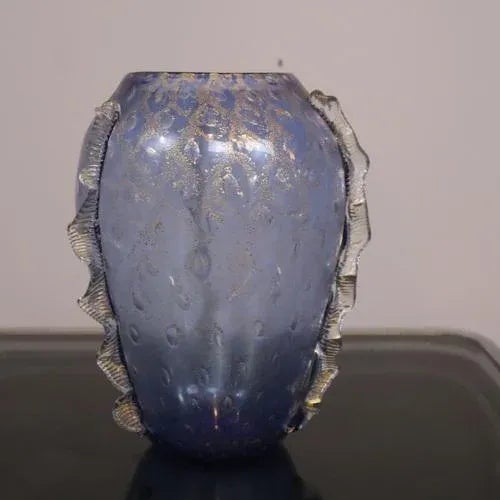 Bring Italian art into your home with this beautiful Vintage Murano Glass Vase, dating back to the 1980s. The fusion of...