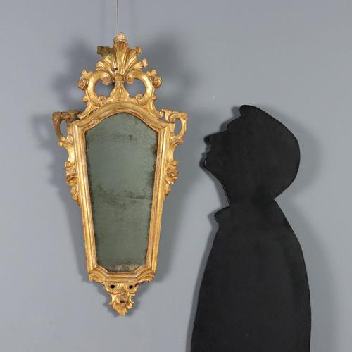 A set of four carved and gilded wooden fans. The top panel features openwork and carvings of scrolls, leaves, and falling...