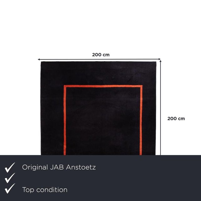 with the JAB Anstoetz Frame, you get a rug that immediately catches the eye with its clean, framed design. The deep black...