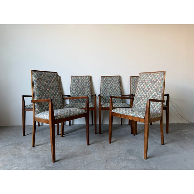 A striking set of six vintage dining armchairs by Dillingham Manufacturing Co. The clean architectural lines, tapered...