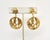 This is part of Chairish’s Costume Jewelry assortment. 1970s Modernist goldtone round smaller tops with larger round...