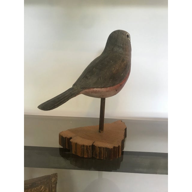 A nicely painted and executed bird sculpture. Artist signed.