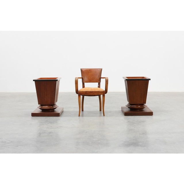 A striking pair of large geometric oak planters dating to the 1930s, crafted in France. Each planter features a strong...