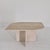 Very nice Italian coffee or side table, fabricated in 1989. It is handcrafted out of very beautiful travertine. The plate...