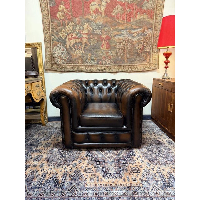 Bring timeless British elegance into your home with this stunning vintage Chesterfield club chair. Crafted with classic...