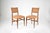 A pair of Italian side chairs by Gio Ponti, from to the 1950s mid-century period in walnut with restored in a beautiful...