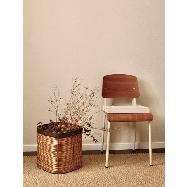 Large Italian rattan and brass planter basket, circa 1970s. The piece features a rounded woven rattan body with vertical...