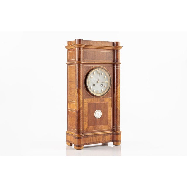 This beautiful antique French wooden mantel clock was made in France circa 1900. This chiming clock with pendulum has a...