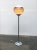 Rare Mid Century floor lamp from Guzzini. The classic Guzzini plastic shade is turned in this design. The shade is...