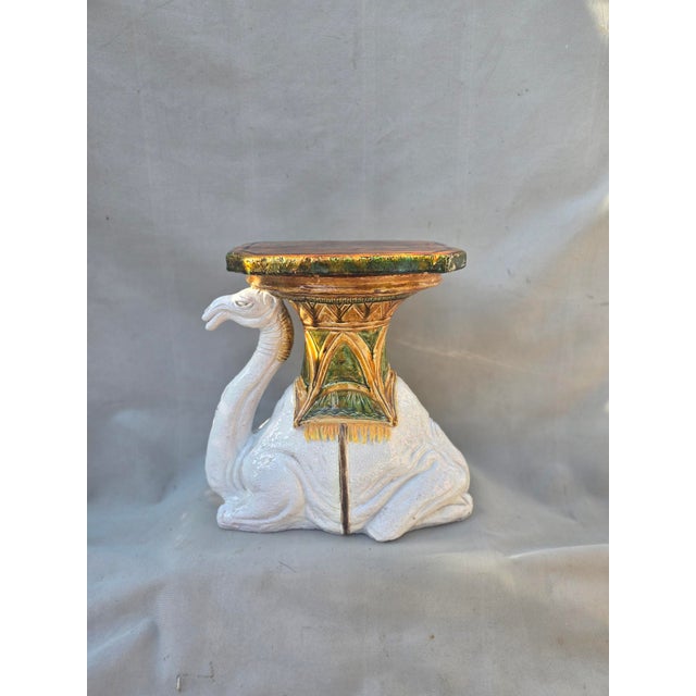 This is a vintage Majolica glazed terracotta camel garden seat. This has vibrant green golds and white hand painted...