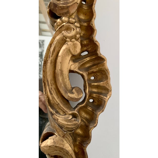 Beautiful louis xv carved wood mirror carved pediment decorated with foliage and roses the glass is a later addition...