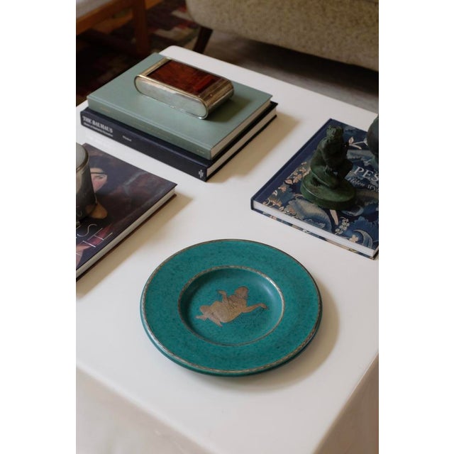 1940's Argenta Stoneware Plate with female siluett decor by Wilhelm Kåge for Gustavsberg. The now iconic Argenta stoneware...