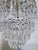 Vintage Hollywood Regency loral Embossed Brass Tiered Waterfall "Wedding Cake" Crystal Chandelier For Sale In New York - Image 6 of 8