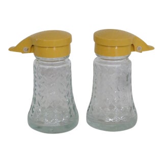 Mid 20th Century Daniells Mid Century Modern Yellow Flip Top Glass Salt and Pepper Shaker Pair For Sale