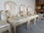 Elegant set of four vintage arm dining chairs manufactured by Century Furniture in the iconic style of Serge Roche,...