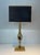 This large and beautiful sculptural lamp is made of brass with an amethyst stone in its center. It is a work of the famous...