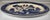 A classic Blue Willow style oval serving platter featuring the iconic cobalt blue chinoiserie landscape with pagodas,...