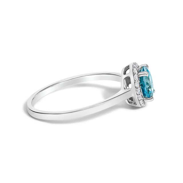 Adorn your hand with the splendor of rich, velvety blue captured in a mesmerizing 6x6 mm topaz, its fiery hues deepened...