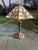 Gorgeous early 20th century American Art Nouveau table lamp with 6-panel caramel slag glass shade. The shade features...