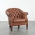 We are offering this cognac-colored Chesterfield club armchair made of cowhide leather in English style, finished with...