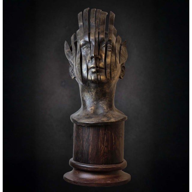 A bronze sculpture by René Hetzel, depicting a male bust rendered in a resolutely contemporary and expressive style. The...