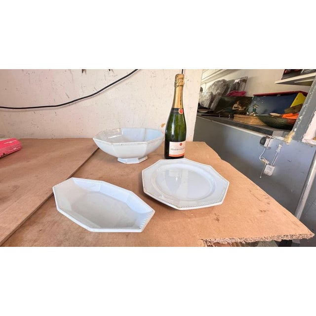 This refined 19th-century French tableware set, created by the prestigious Creil Montereau manufactory, includes a salad...