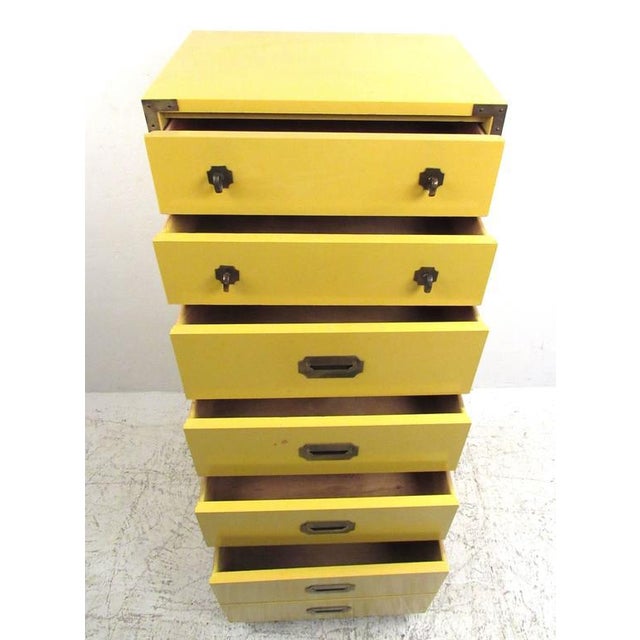 Stylish campaign style lingerie chest features unique yellow lacquered finish and campaign style brass trim. Ideal storage...
