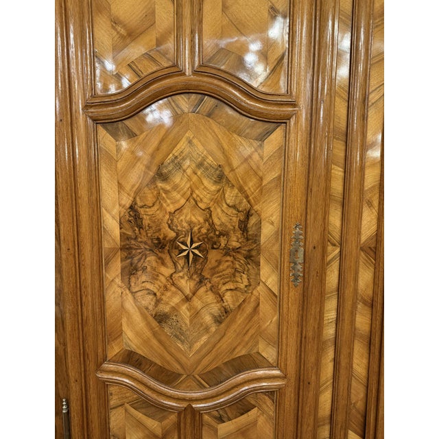 This monumental wardrobe is an outstanding example of german baroque cabinetmaking from the late 18th century, a period...