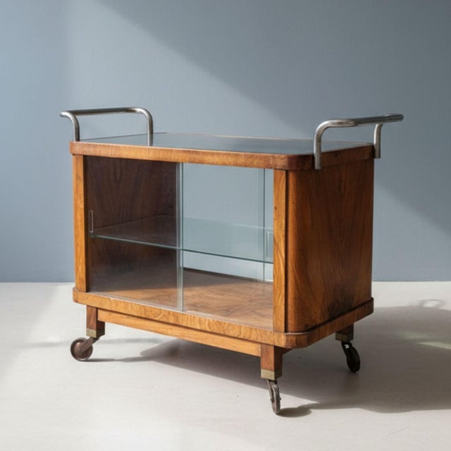 Elegant Art Deco serving trolley from the 1930s, a classic representative of interwar Central European interior design....