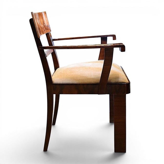 An Art Deco armchair dating from the first half of the 20th century, crafted from veneered wood with a beautiful, natural...