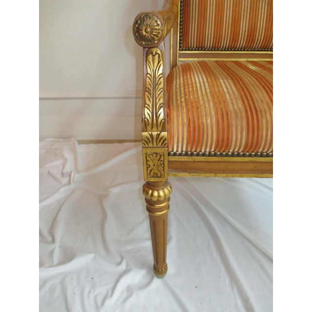 Vintage Isenhour giltwood accent chair with detailed carvings and nailhead trim. Striped upholstery is original. Minimal...