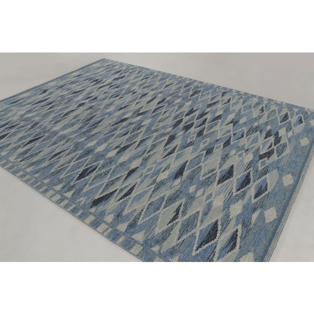 Handwoven in high-quality wool, this 9x12 contemporary rug joins Rug & Kilim’s Scandinavian collection, featuring a...
