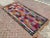 This beautiful, traditional vintage, flatweaved Turkish kilim rug is approximately 60 years old. It is handmade of very...
