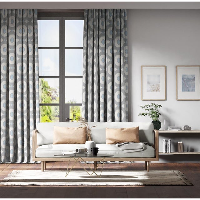 Sharing a global traveller feel and ikat edged motif Zinnia‚Äôs woven satin ground contrasts with its textural circular...