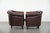 Offered is this set of two classic English-style Chesterfield club chairs in cowhide leather, finished with decorative...
